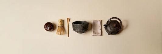 Japanese tea ceremony utensils arranged for traditional matcha preparation