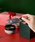 Hand taking a matcha sachet out of the advent calendar